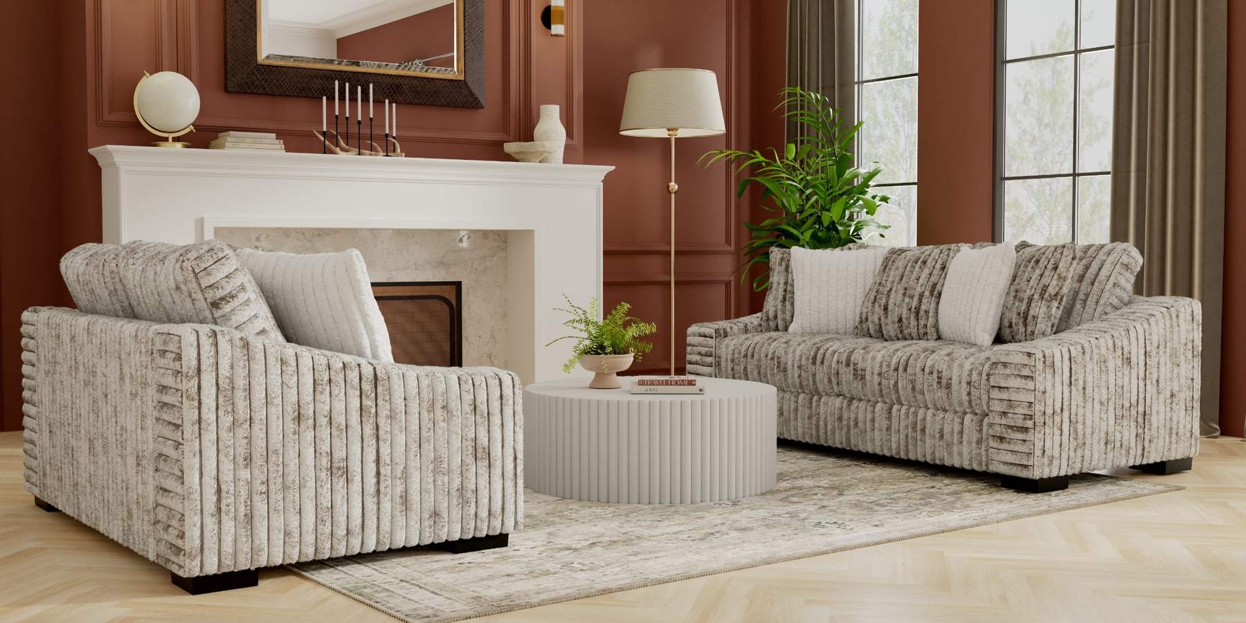 Sofa and loveseat beside a fireplace